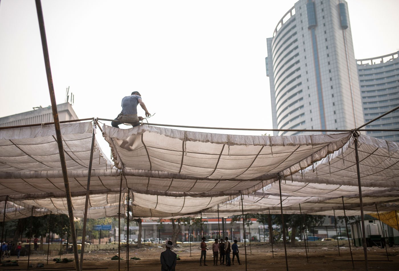 Labourers building tents for the farmers at Ramlila ground