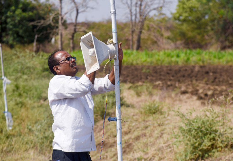 Suresh Renghe, a farmer in Mangi village of Yavatmal district demonstrates the working of a farm alarm device used to frighten wild animals, mainly wild boar and blue bulls that enter fields and devour crops