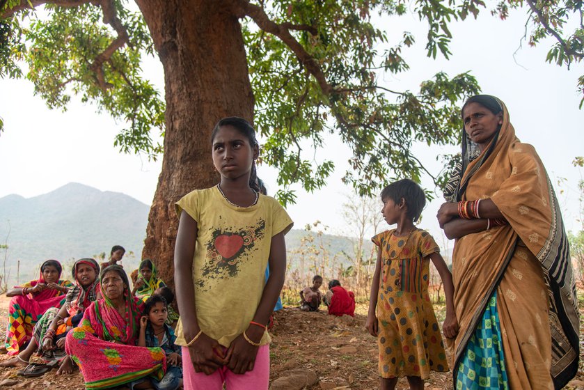 After the school in their village, Barabanki shut down, Mami (standing in a saree) kept her nine-year-old daughter, Chandrika Behera (left) at home as the new school is in another village, 3.5 km away.