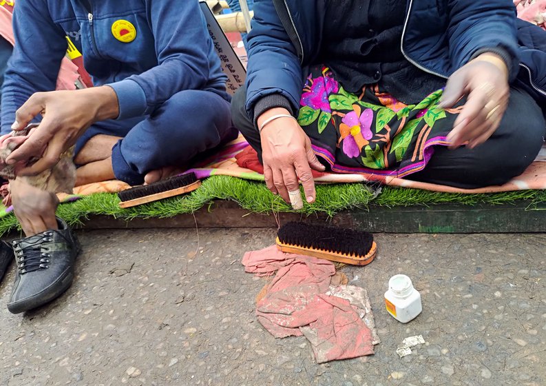 'I cannot usually sit for one hour straight. But once we come here, I clean shoes for six hours and feel no pain while doing so,' says Jaswinder, who suffers from chronic back pain. 'I am a daughter of farmers. I cannot see them in pain. I polish their shoes', says Prakash