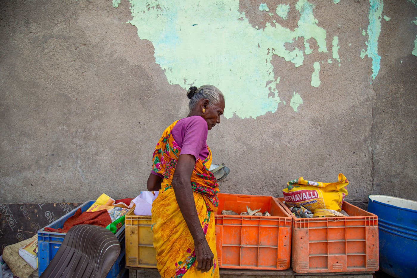 Fathima inspecting her wares