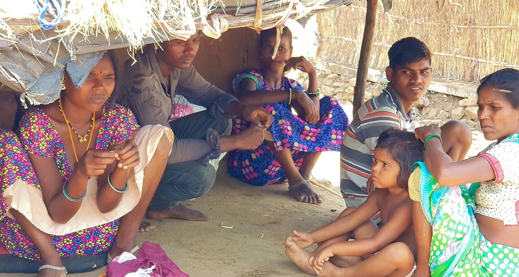 In Boranda, a group sat talking about the present situation. The annual market, where some of the Katkaris sell mahua (right), was cancelled due to the lockdown