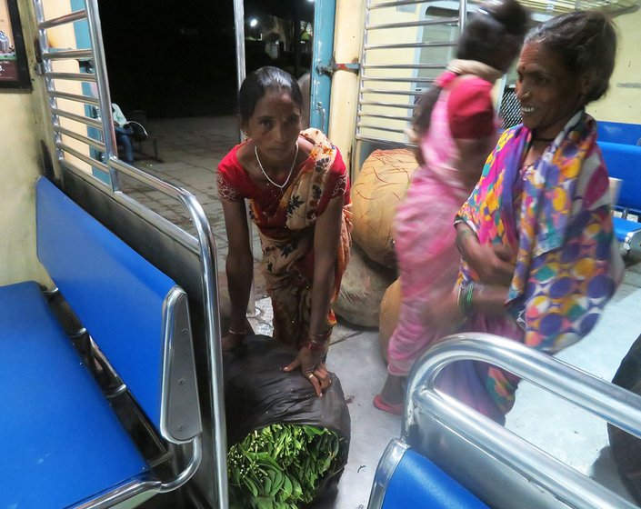 Tulshi adjusting the load of palash leaves 