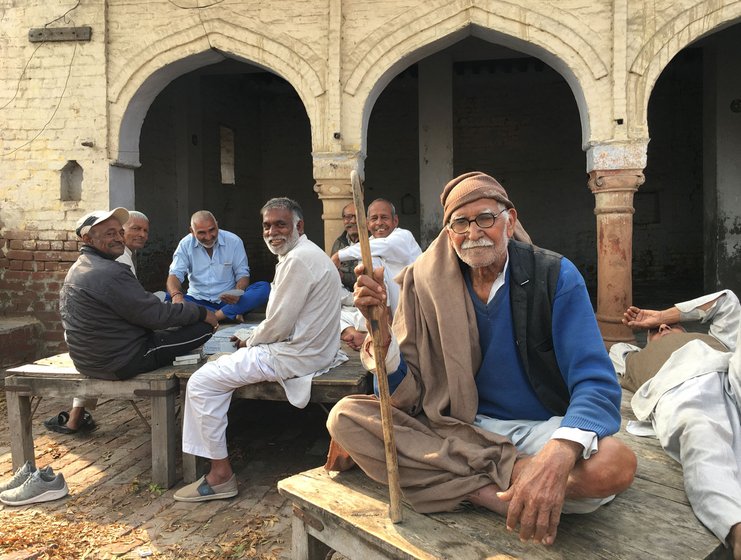 Only men occupy the chaupal at the village centre in Harsana Kalan, often playing cards. 'Why should women come here?' one of them asks