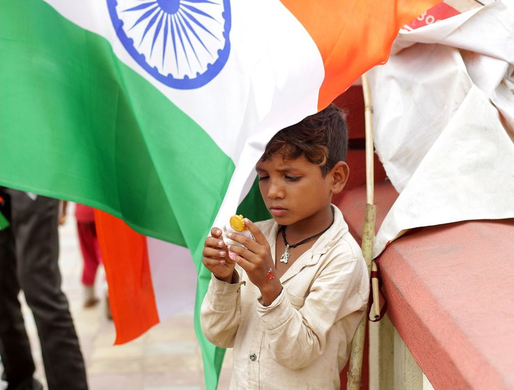 Suresh's eldest son playing with a toy