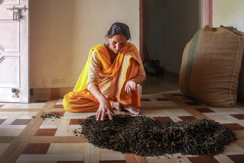 Sumna (right) does the grading and packaging of tea