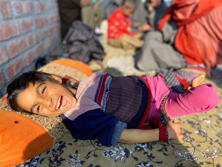 The family sitting in the sun outside Arshid’s parents’ home in Rakh-e-Arth, Srinagar