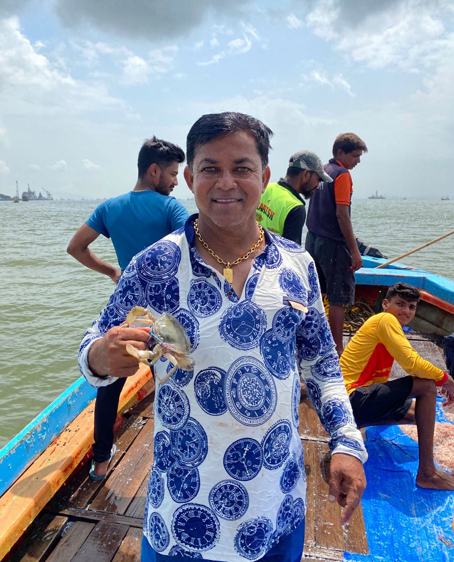 Dilip Koli holding a crab: “During a crisis, farmers at least get some compensation from the government. But fishermen don’t get anything even though farmers and fishermen are both like brothers.”