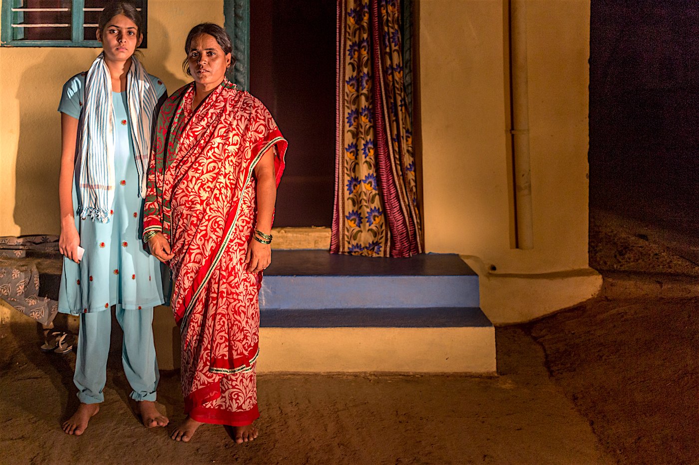 Naditha and Salamma outside their home