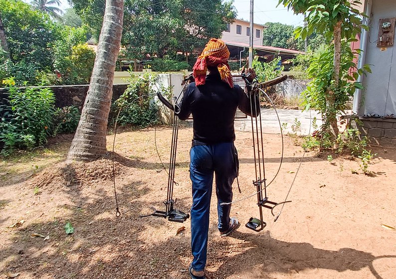 Humayun attaches his apparatus to the back of his cycle when he goes from one house to the other