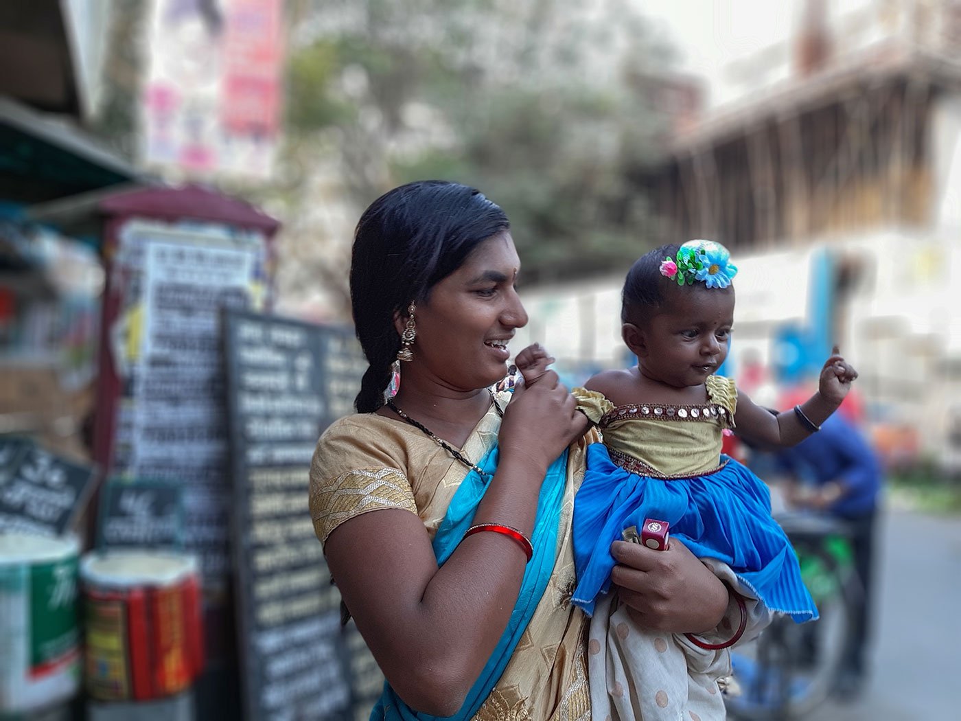 Pooja buys her daughter Sheetal a new clip to match with her frock form the market