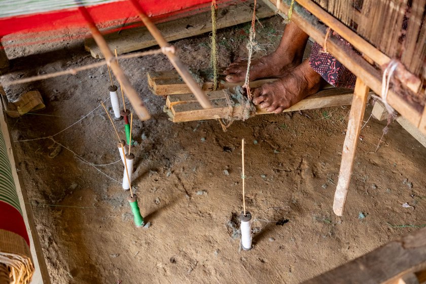 Right: Roopchand weaving a gamcha while operating the loom with his bare feet