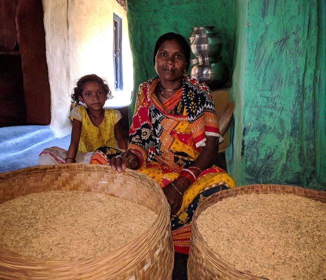 Rukmani Khillo set to pack and store Machhakanta and Muktabali rice varieties for the next sowing season