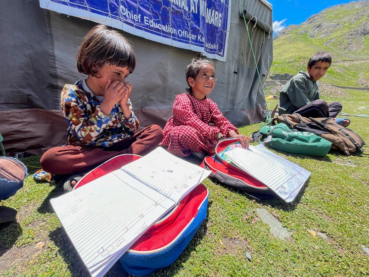 Right: Ishrat, Rifat and Nawaz (from left to right) reading under Tariq's watchful eye