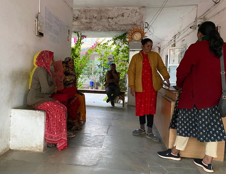 Left: Teena Garasia (green sweater) heads Banswara Livelihood Bureau's Migrant Women Workers Reference Center; Anita Babulal (purple sari) is a Senior Associate at Aaajevika Bureaa, and Kanku (uses only this name) is a sanghatan (group) leader. Jyotsana (standing) also from Aajeevika, is a community counselor stationed at the police station, and seen here helping families with paperwork