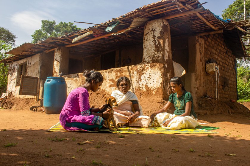 Right: Amma is seated outside our home with my sister Kumari and my niece, Ramya