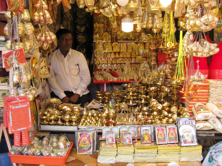 Left: Suresh Suryavanshi says the temple has been closed for the first time in history. Right: 'How can I just sit at home?' asks Anil Solapure, in tears

