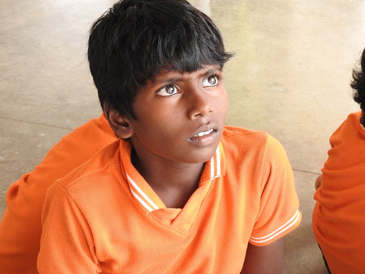 A student listening to the teacher’s discourse on Dussehra. 