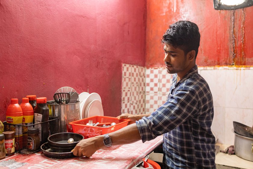 'I'm known to have one of the cleanest kitchens in Majuli,' says Biman. Right: His young cousin often comes to help out at the eatery