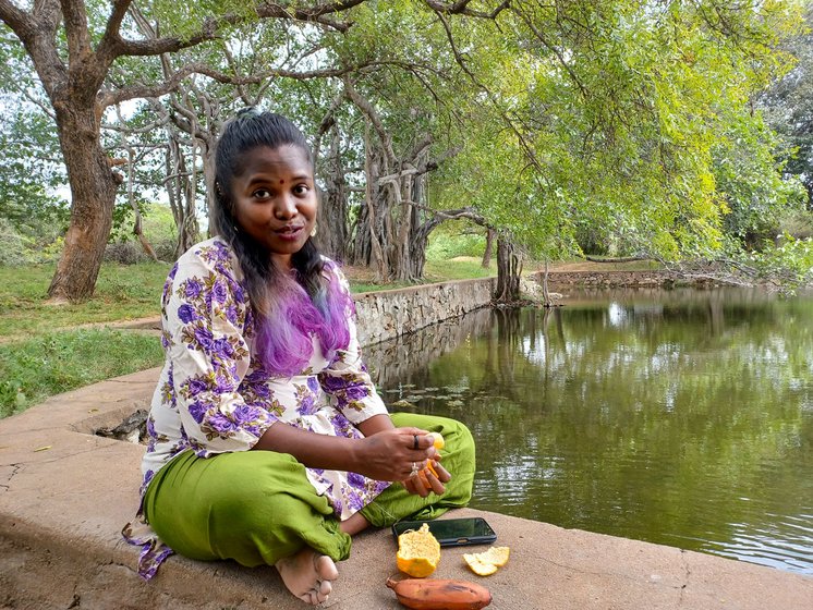 Rathy tells me stories as we sit under a big banyan tree near the temple