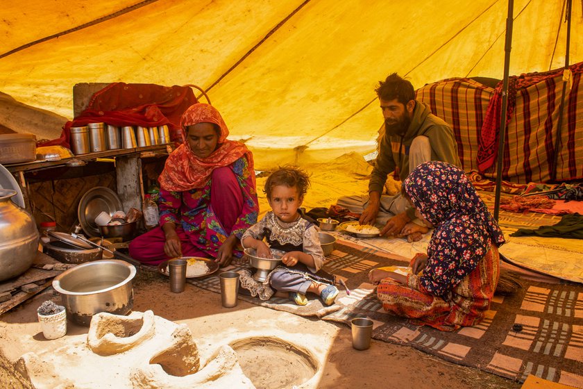 Shakeel Ahmad (left) enjoying lunch on a sunny afternoon in Wayil, Ganderbal with his wife Tazeeb Bano, and daughters Nazia and Rutba. The wait is finally over and the family are packing up to move into the higher Himalayas