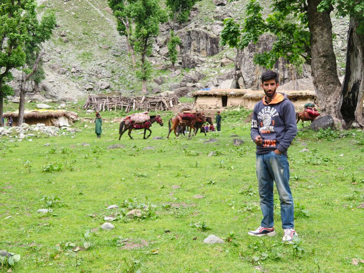 Left: Ali with the mud homes of the Gujjars in Khalan settlement behind him.