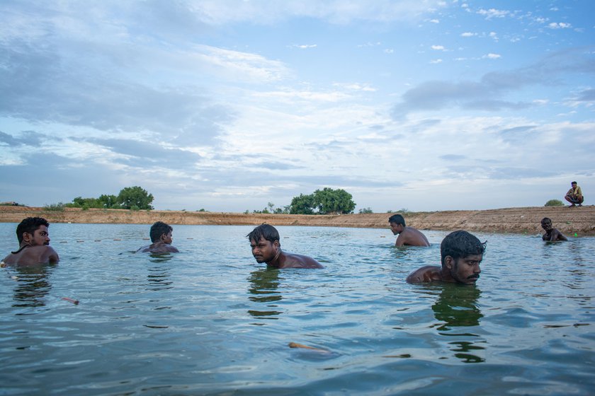 Right: They have to dive into the lake to drag out their nets