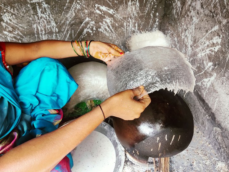 Right: Vijaya uses only a few fingers to separate the thinly formed film from the inverted pot