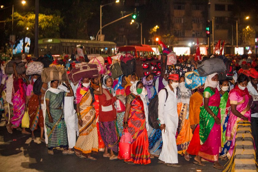 Arriving at night at Azad Maidan in Mumbai, the tired farmers celebrated with the tarpa, a musical instrument (left)