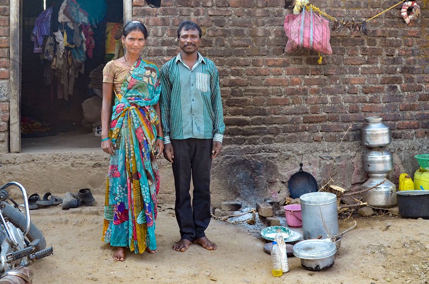 Hindos Pawar and wife outside their house