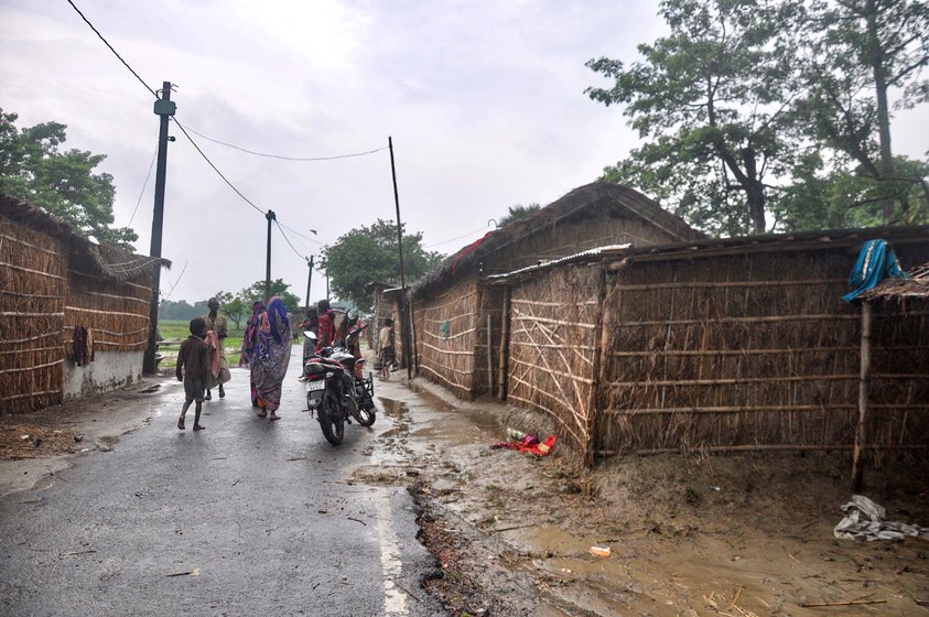 A shared drinking water trough (left) along the roadside constructed with panchayat funds for the few cattle in Musahar Tola (right)