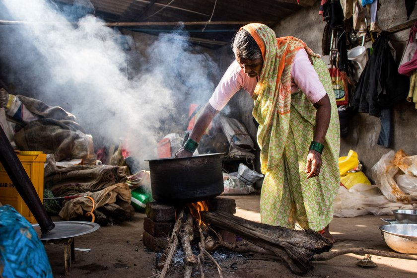 She stirs the mix of crushed castor seeds and water