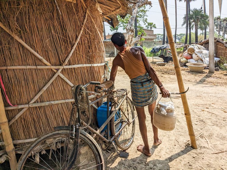 Ajay will transfer the fresh toddy which has a lather of white foam to a bigger plastic jar fixed to his bicycle.