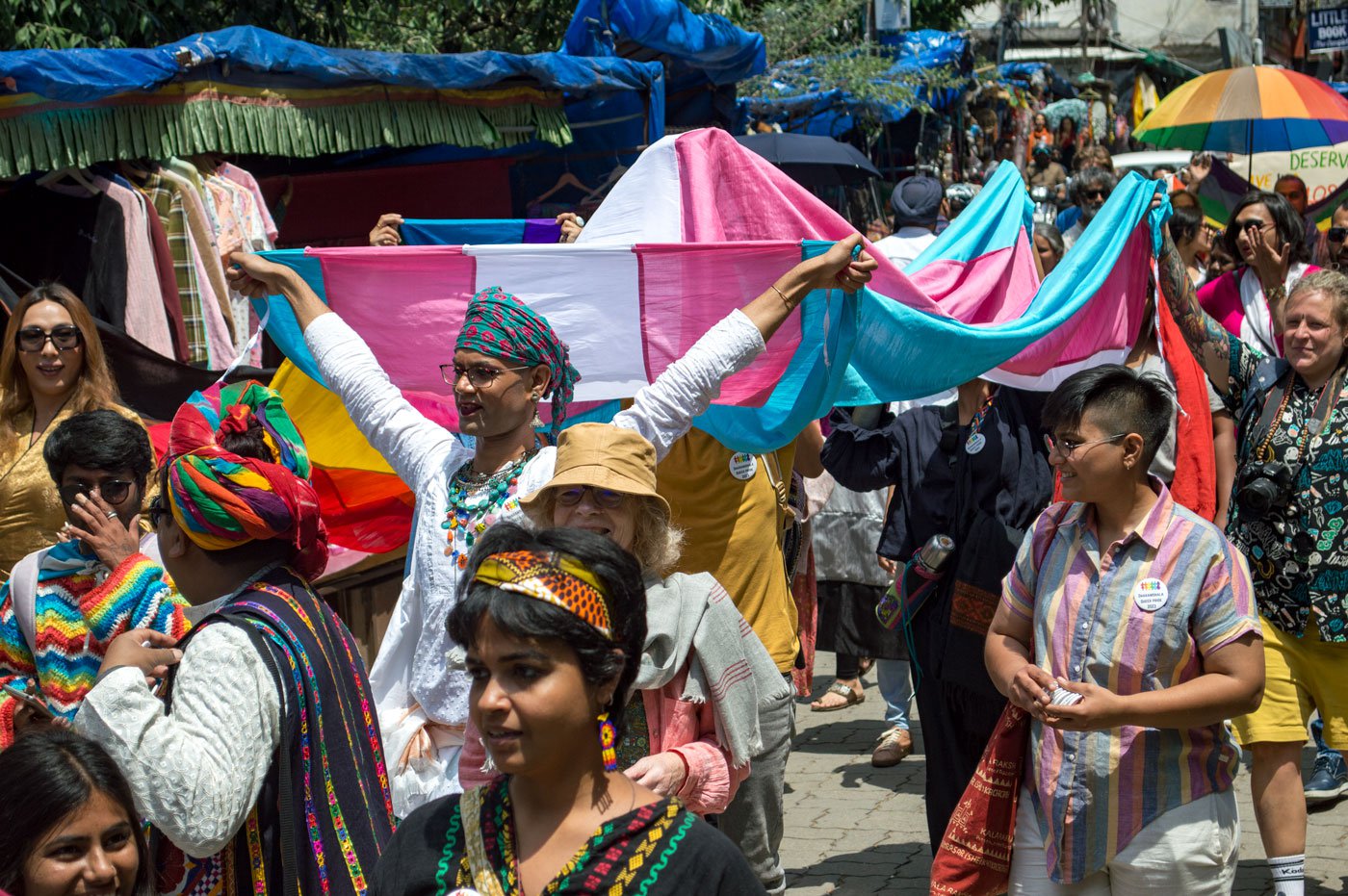 Anant Dayal, one of the organisers, holds a flag symbolising trans rights