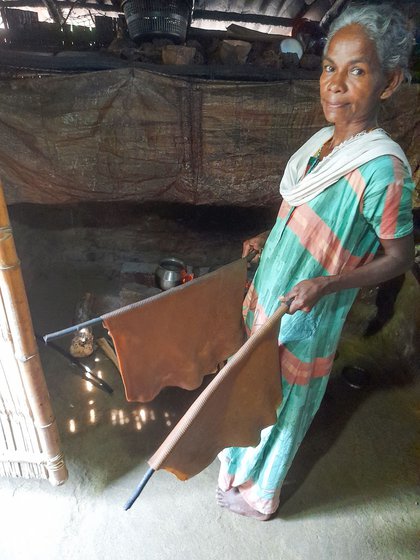 To dry them out further, the sheets are hung in the kitchen. 'The heat from the fire dries the sheets.' says Leela. They turn brown in colour when dry