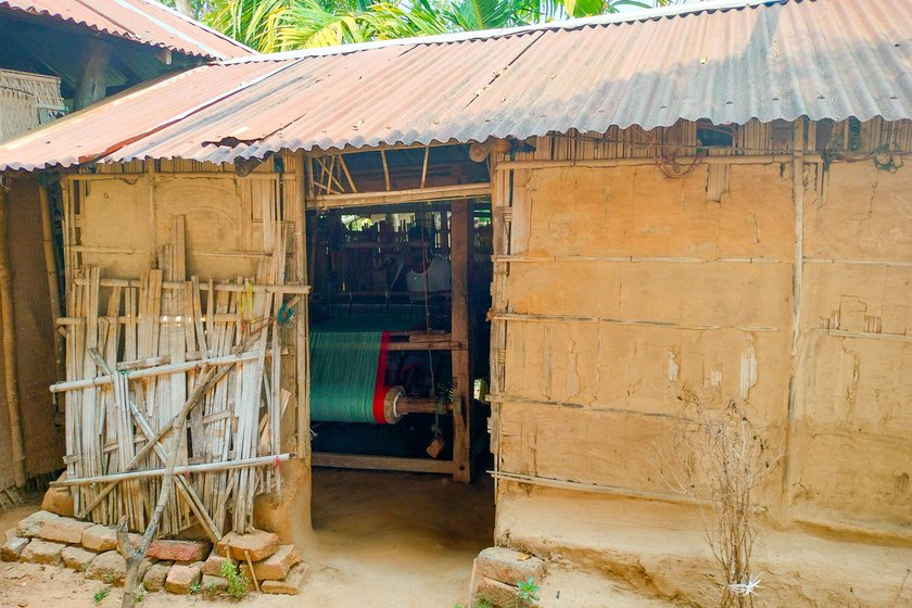 Right: A hut made from bamboo and mud with a tin roof serves as Roopchand's workspace