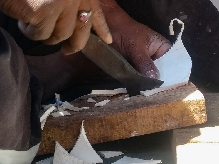 For four-piece balls, leather is cut (right) into oval pieces that will make four quarters of a ball