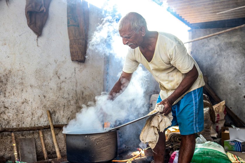 Right: Narayan Gaikwad, who has been extracting castor oil since the mid-1950s, inspects the extraction process.