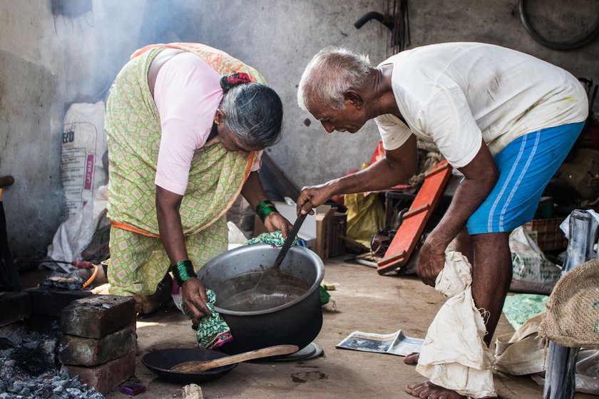 After stirring the castor seeds and water mixture for two hours, Narayan and Kusum separate the oil floating on top from the sediments