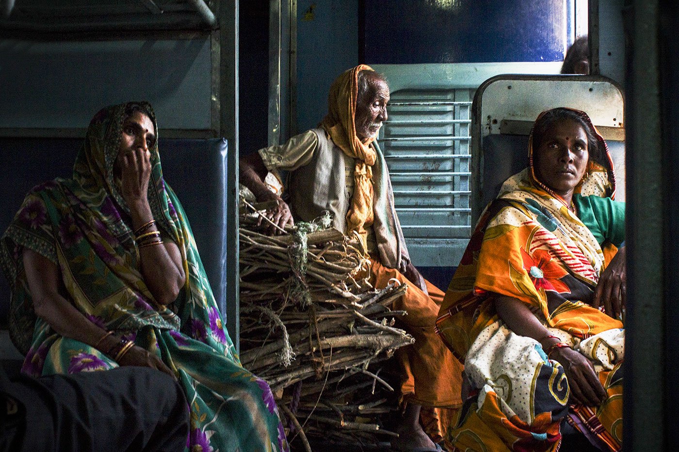 Tired,  returning from the daily chaos of survival. Selling firewood barely brings Rs. 100-300 a day, depending on weather conditions, market demand, and the quality of wood 