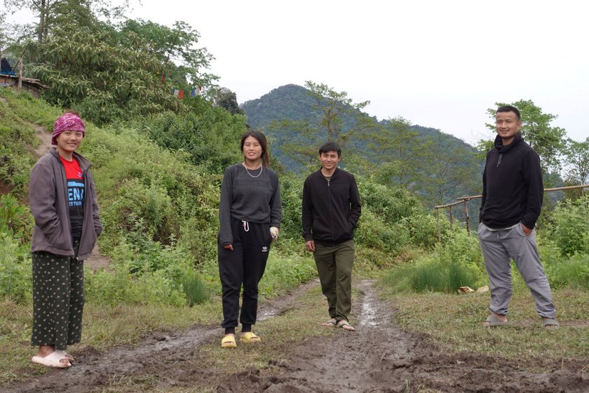 Left: From left to right, Dema, Aiti, Dambar and Micah outside their camp in Bongpu Blangsa.