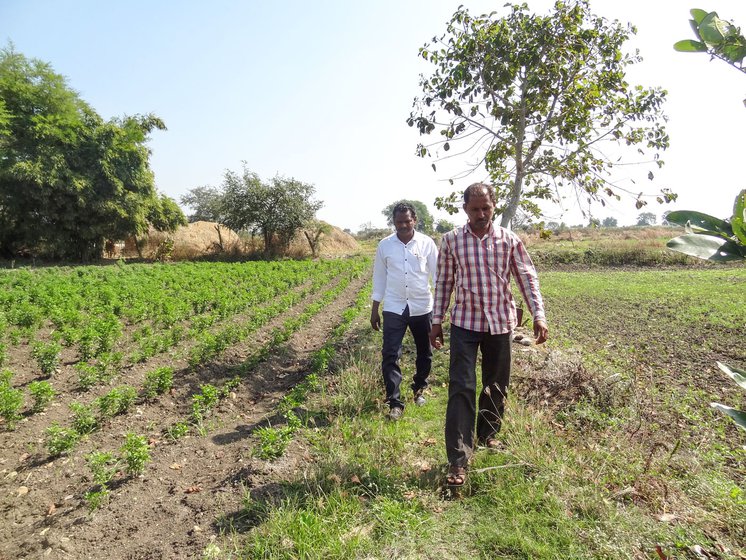 Namdeo Tarale with Meghraj Ladke, a farmer from Dhamani village. Ladke, 41, stopped nightly vigils after confronting a wild boar on his farm.