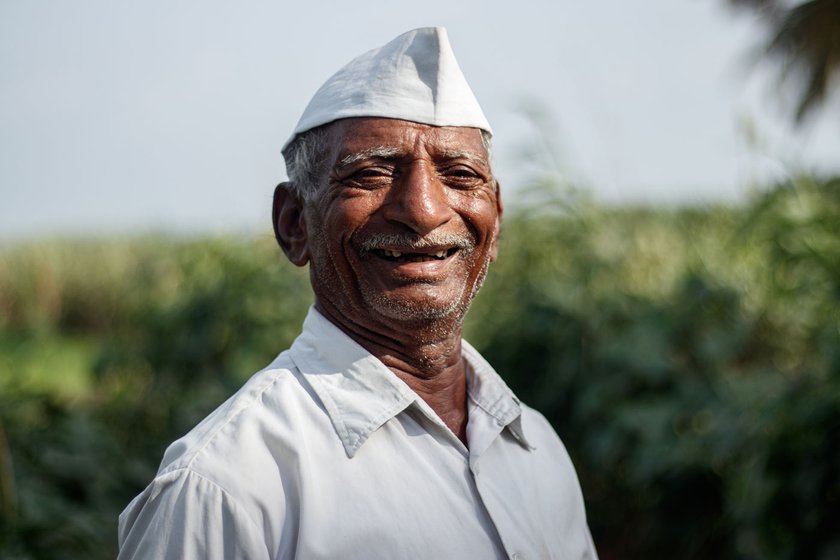 ' A castor plant is a farmer’s umbrella,' says Narayan (right) as he points towards the tapering ends of the leaves that help repel water during the rainy season