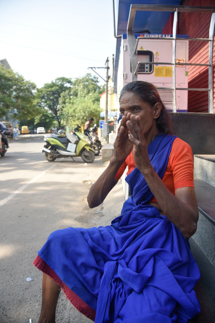 Rita akka responds to a question in gestures, and then flashes a smile

