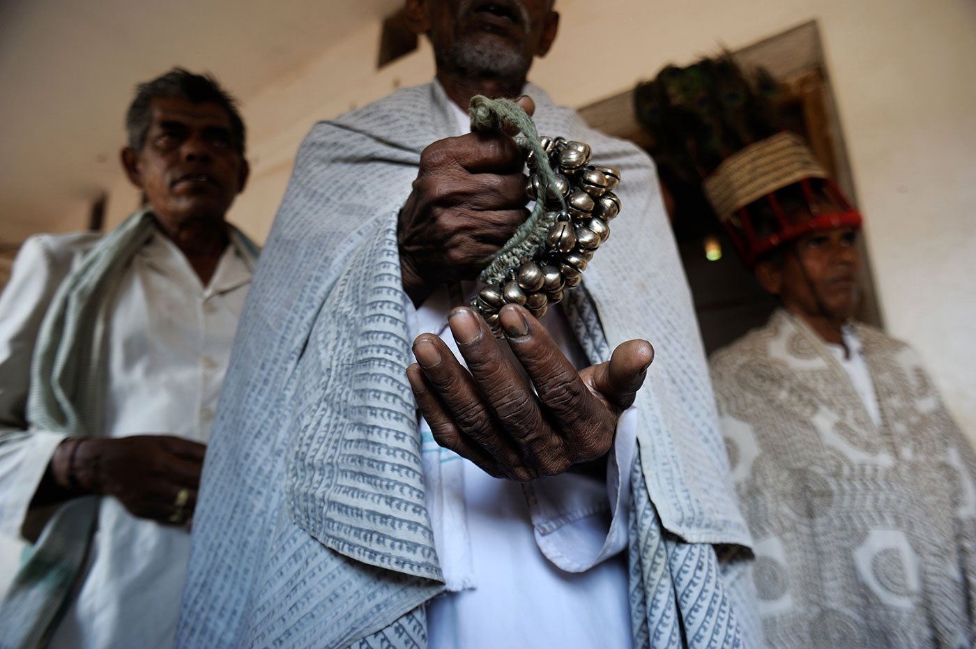 Men using ghunghru which is a clutch of bells used to keep rhythm while the Ramnamis sing chaupai (quatrain verses) from the Ramcharitmanas