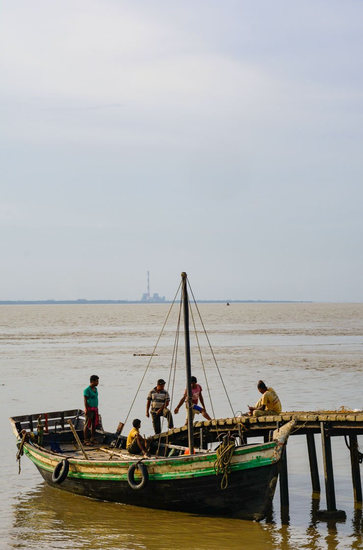 Left: Trying to make a living by catching fish in Bidya river in Amtali village. Right: Dhananjoy Bhuniya returning home to Sitarampur from Nayachar island 

