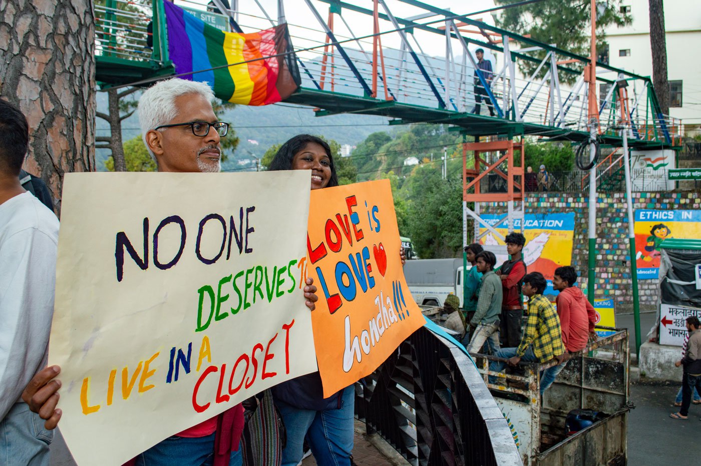 A few posters in support of the queer community displayed at the march