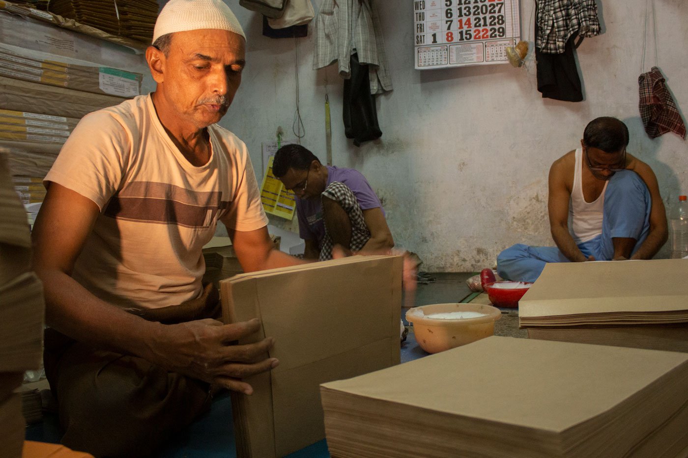 Hanif Khan Bismillah Khan Pathan at Taj Envelopes stacks the covers with open flaps according to their sizes