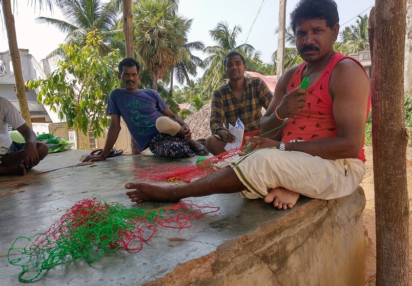 Man working on fish net