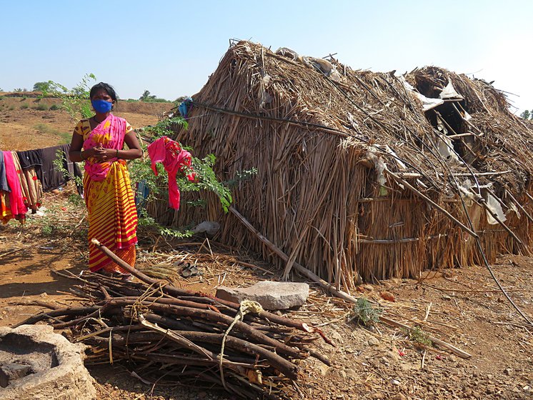 With Amol in 'isolation', his mother Sunita (left) and siblings remained in their own small hut nearby (right)